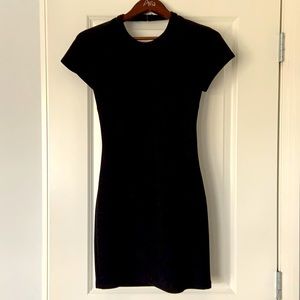 Black fitted mini dress with open back